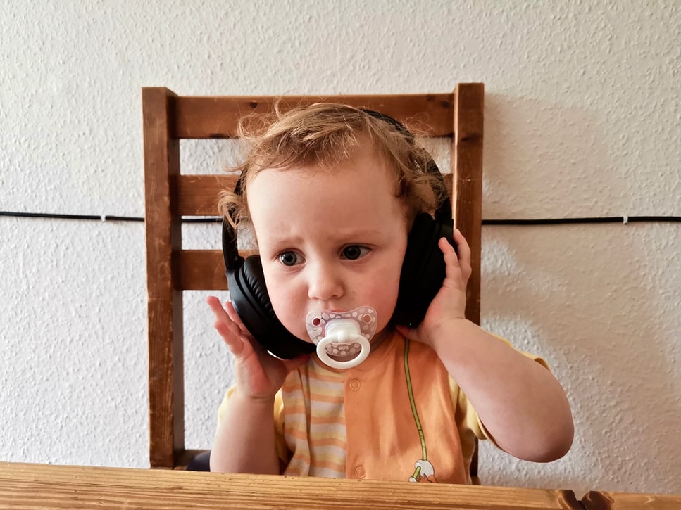 uneasy-looking child with headphones
